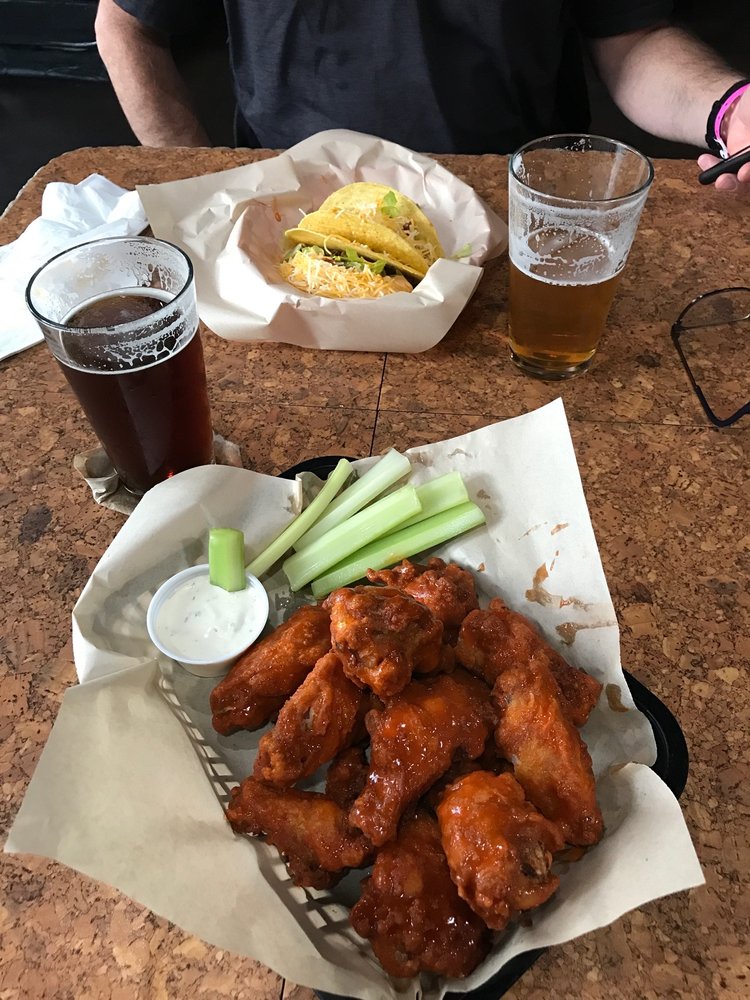 Bar N9NE tacos served with wings and cold beer