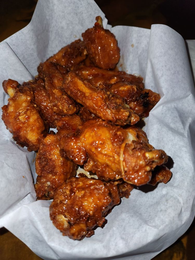 Basket of Bar N9NE wings with dipping sauce