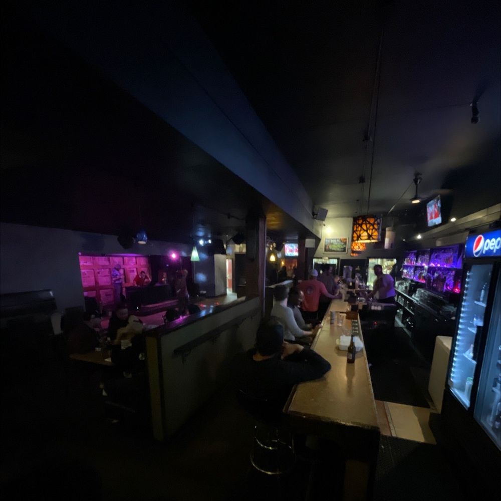 Karaoke night at Bar N9NE with stage lights and a crowd